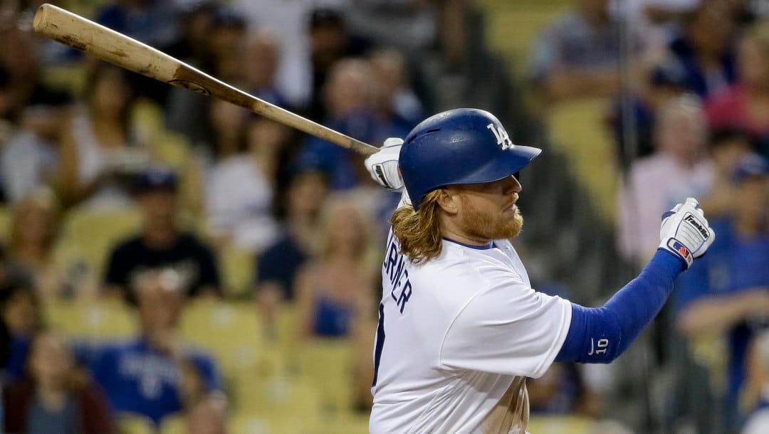 Los Angeles Dodgers' Justin Turner watches his RBI-single against the Atlanta Braves during the third inning of a baseball game in Los Angeles, Saturday, June 4, 2016. 