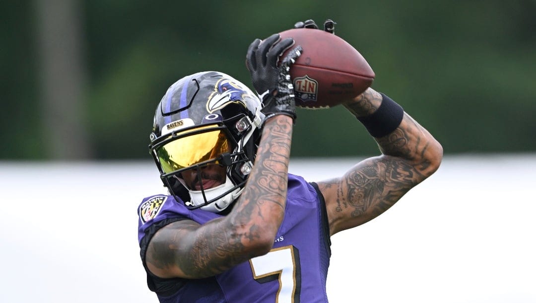 Baltimore Ravens wide receiver Rashod Bateman takes part in drills at the NFL Football Team's practice in Owings Mills, Md., Wednesday, July 27, 2022,(AP Photo/Gail Burton)