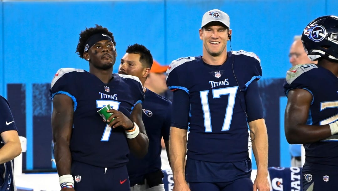 Tennessee Titans quarterbacks Malik Willis (7) and Ryan Tannehill (17) stand on the sideline in the second half of a preseason NFL football game against the Tampa Bay Buccaneers Saturday, Aug. 20, 2022, in Nashville, Tenn. (AP Photo/Mark Zaleski)