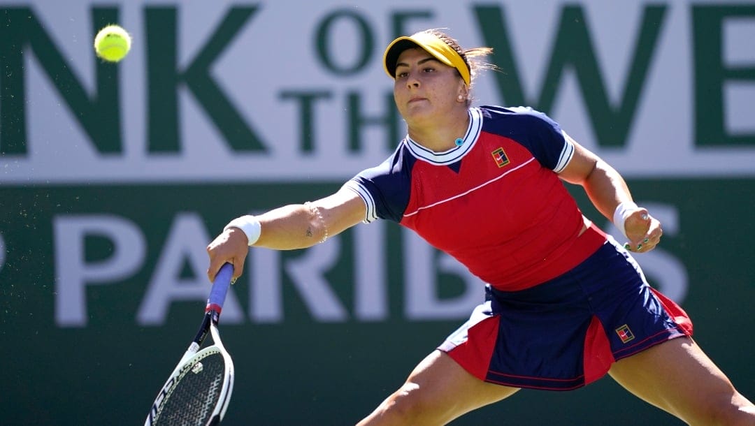 Bianca Andreescu, of Canada, returns to Anett Kontaveit, of Estonia, at the BNP Paribas Open tennis tournament Monday, Oct. 11, 2021, in Indian Wells, Calif.