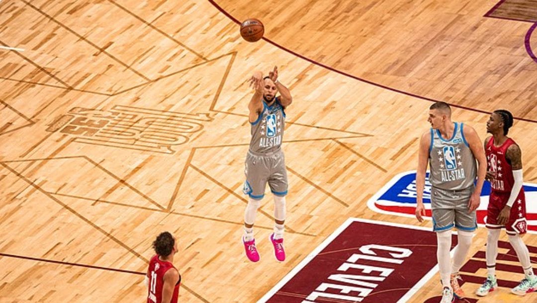 Stephen Curry of the Golden State Warriors shoots a half-court shot during the 2022 NBA All-Star game.