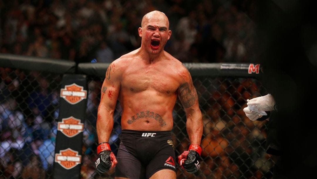Robbie Lawler celebrates after defeating Rory MacDonald during their welterweight title fight mixed martial arts bout.