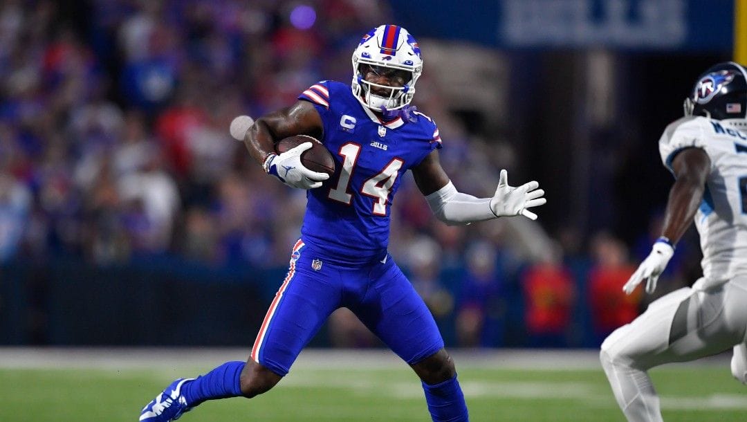 Buffalo Bills wide receiver Stefon Diggs (14) runs with the ball during the first half an NFL football game against the Tennessee Titans in Orchard Park, N.Y., Monday, Sept. 19, 2022.