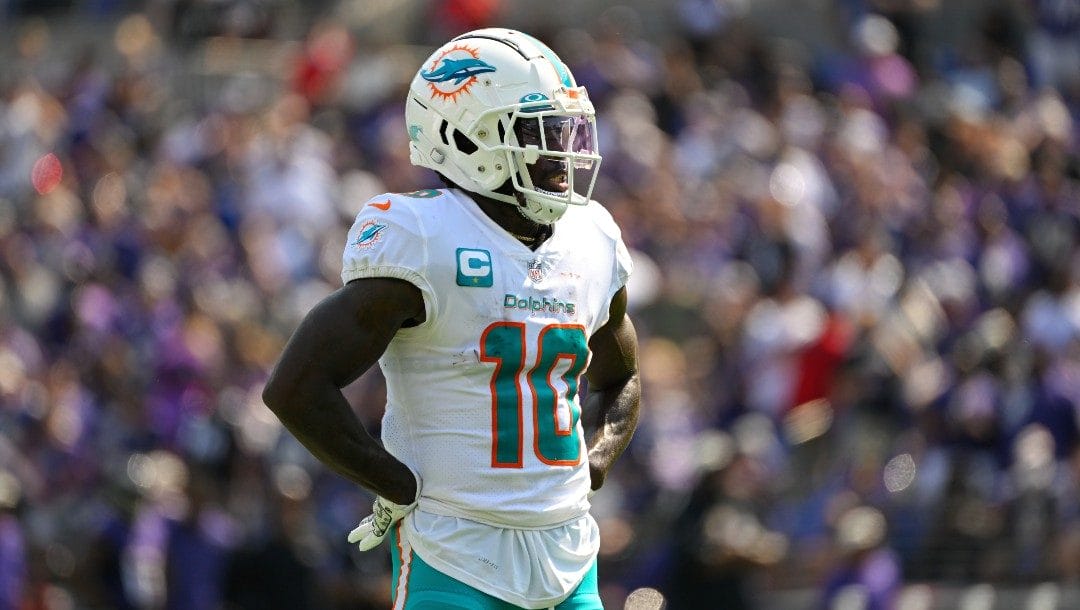 Miami Dolphins wide receiver Tyreek Hill (10) looks on between plays during the first half of a NFL football game against the Baltimore Ravens, Sunday, Sept. 18, 2022, in Baltimore.