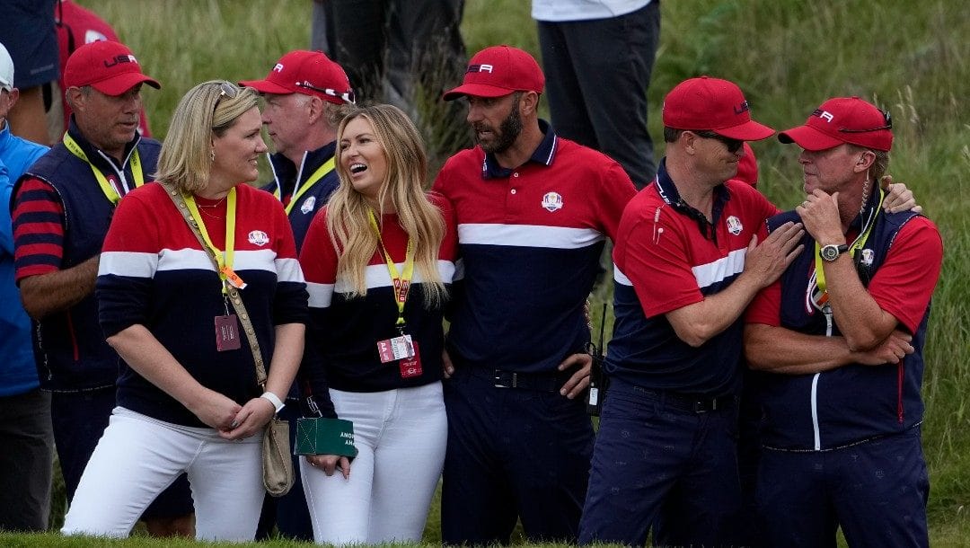 Team USA captain Steve Stricker is congratulated by assistant captain Zack Johnson after the Ryder Cup matches at the Whistling Straits Golf Course Sunday, Sept. 26, 2021, in Sheboygan, Wis.