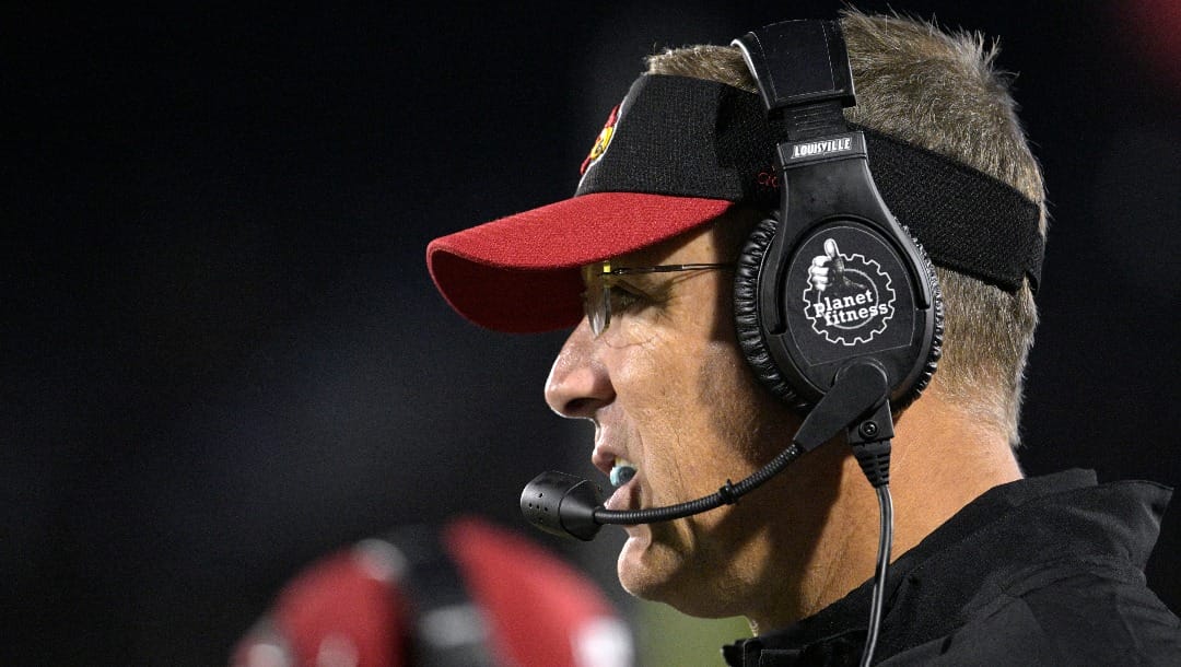 Louisville head coach Scott Satterfield watches from the sideline during the first half of an NCAA college football game against Central Florida on Friday, Sept. 9, 2022, in Orlando, Fla. (AP Photo/Phelan M. Ebenhack)