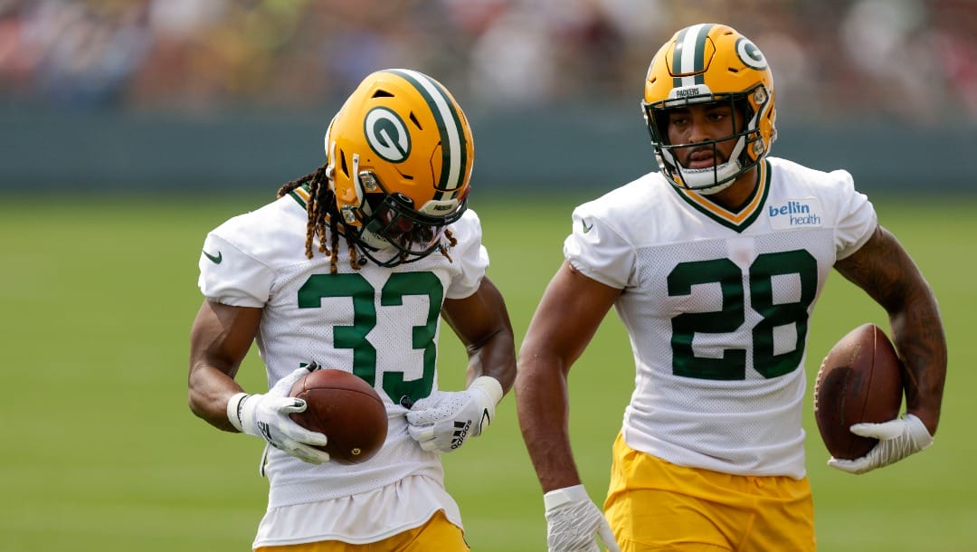 Green Bay Packers' running back Aaron Jones (33) and running back AJ Dillon (28) during NFL football training camp Wednesday, July 28, 2021, in Green Bay, Wis. (AP Photo/Matt Ludtke)