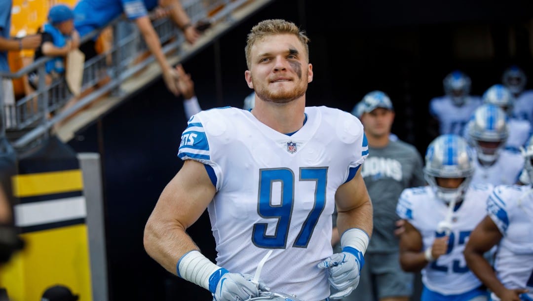 Detroit Lions defensive end Aidan Hutchinson (97) runs onto the field before a preseason NFL football game, Sunday, Aug. 28, 2022, in Pittsburgh, PA. (AP Photo/Matt Durisko)