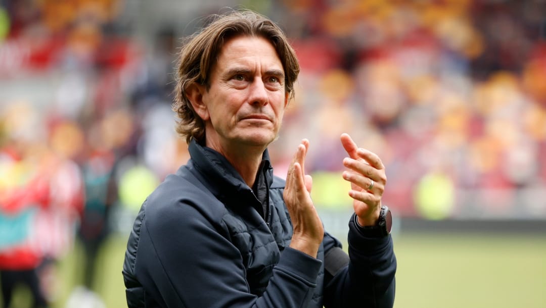 Brentford's head coach Thomas Frank applauds at the end of the English Premier League soccer match between Brentford and Arsenal, at the Gtech Community stadium, London, Sunday, Sept.18, 2022. Arsenal won 3-0.