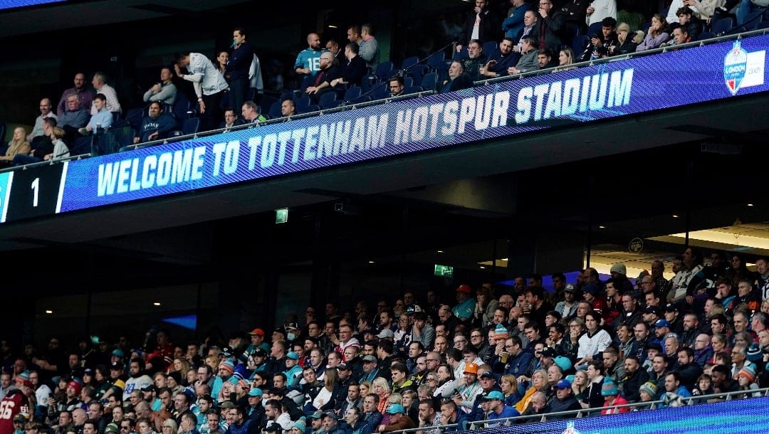 FILE - Fans watch the Jacksonville Jaguars take on the Miami Dolphins during an NFL football game at Tottenham Hotspur Stadium in London, Oct. 17, 2021.