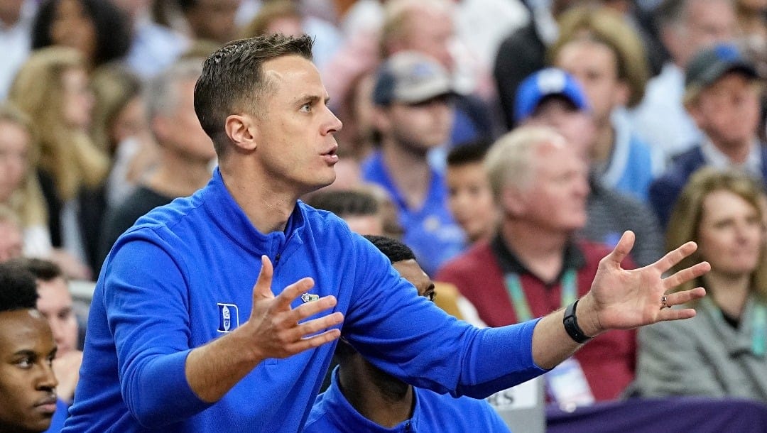 Duke assistant coach Jon Scheyer yells during the first half of a college basketball game against North Carolina in the semifinal round of the Men's Final Four NCAA tournament, Saturday, April 2, 2022, in New Orleans. (AP Photo/David J. Phillip)