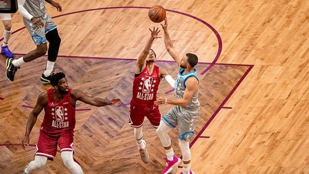 Stephen Curry shoots over Trae Young during the 2022 NBA All-Star game.