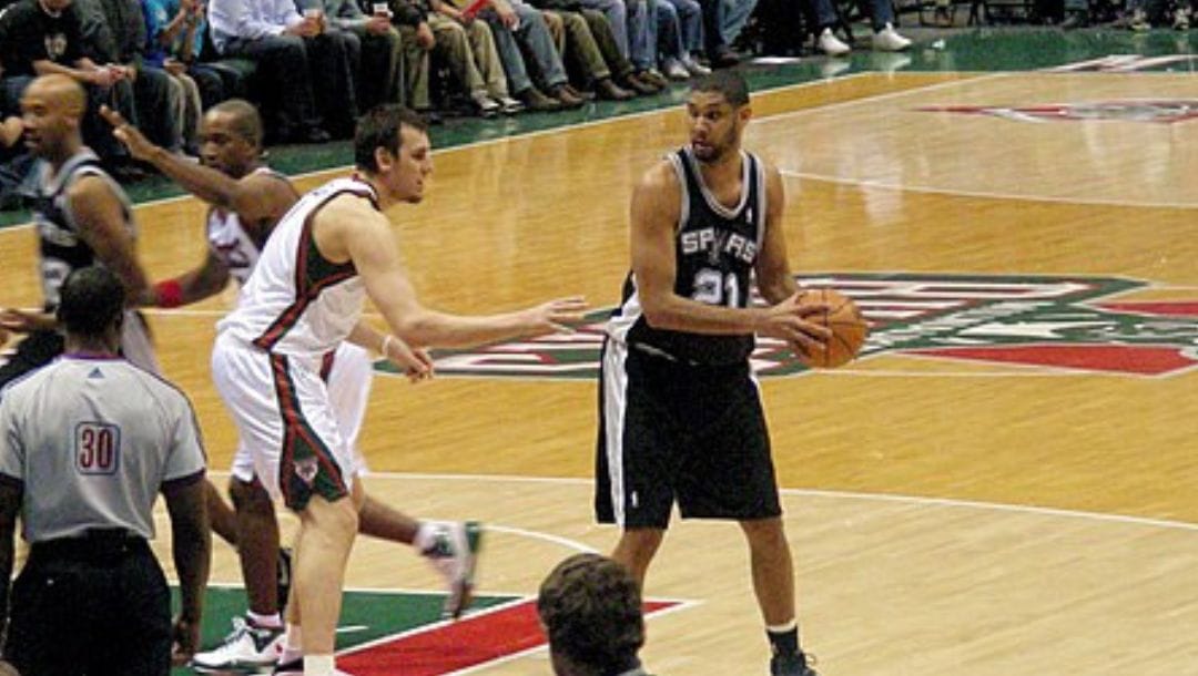 Tim Duncan plays against Andrew Bogut and the Milwaukee Bucks in 2008.