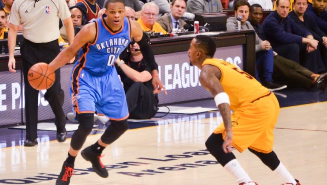 Russell Westbrook of the Oklahoma City Thunder against J. R. Smith of the Cleveland Cavaliers.