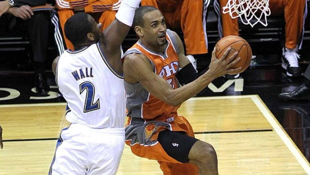 Grant Hill shoots a basket against John Wall in 2011.