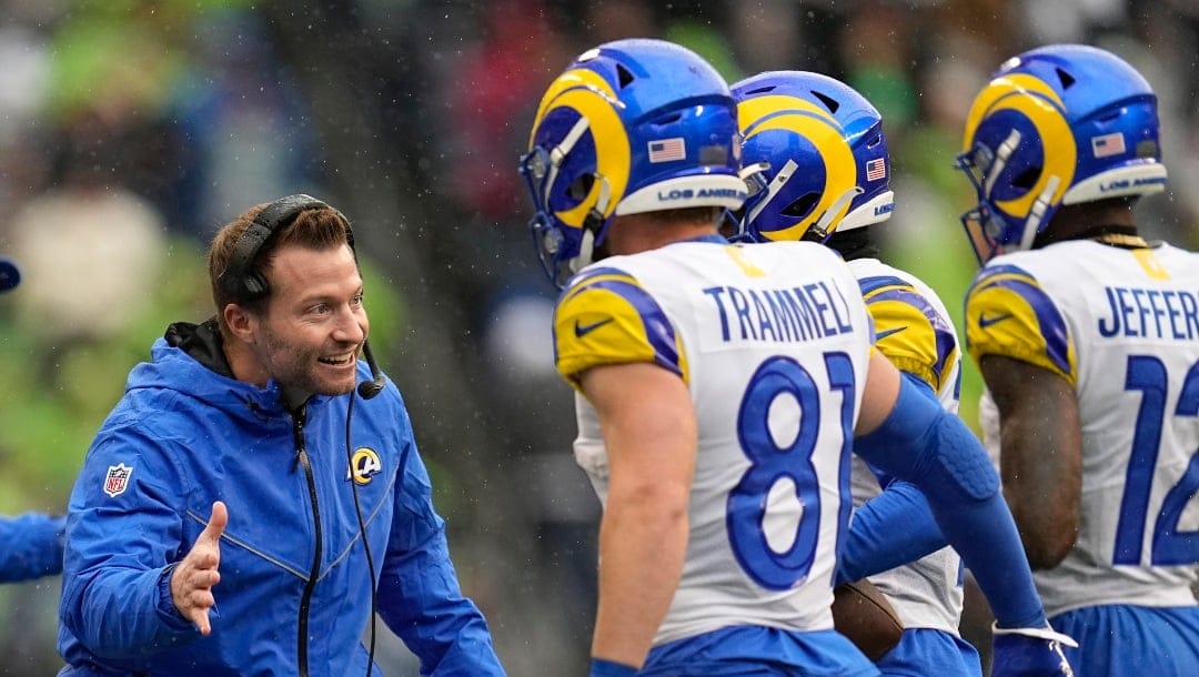 Los Angeles Rams head coach Sean McVay, left, greets his team after a touchdown against the Seattle Seahawks during the first half of an NFL football game Sunday, Jan. 8, 2023, in Seattle. (AP Photo/Abbie Parr)
