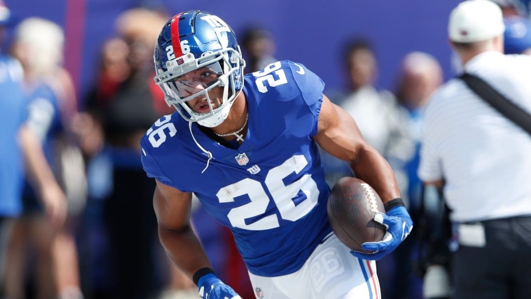 New York Giants' Saquon Barkley warms-up before an NFL football game against the Carolina Panthers, Sunday, Sept. 18, 2022, in East Rutherford, N.J. (AP Photo/Noah K. Murray)
