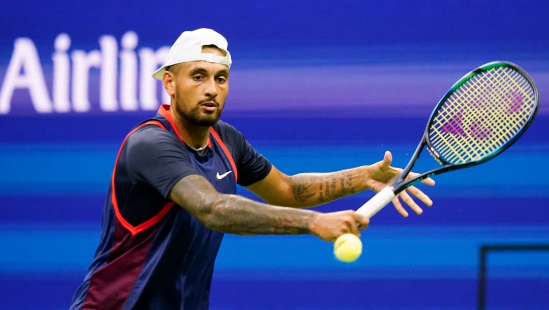 Nick Kyrgios, of Australia, returns a shot to Thanasi Kokkinakis, of Australia, during the first round of the US Open tennis championships, Monday, Aug. 29, 2022, in New York.