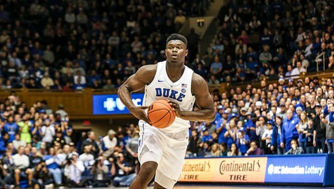 Zion Williamson looks to pass the ball during a college game with Duke.