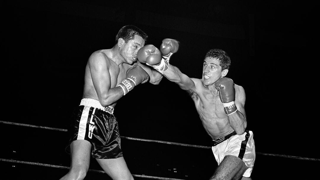 Champion Eder Jofre of Brazil lands a neat right to the nose of challenger Herman Marquez of Stockton, Calif. in eighth round.