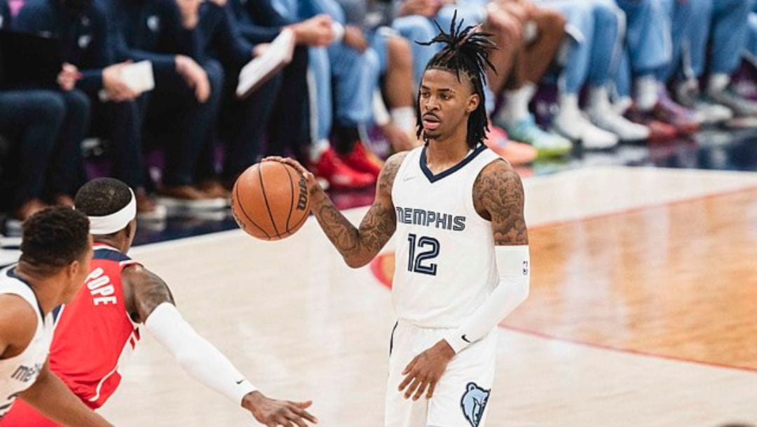 Ja Morant of the Memphis Grizzlies dribbles the ball against the Washington Wizards in an NBA game in 2021.