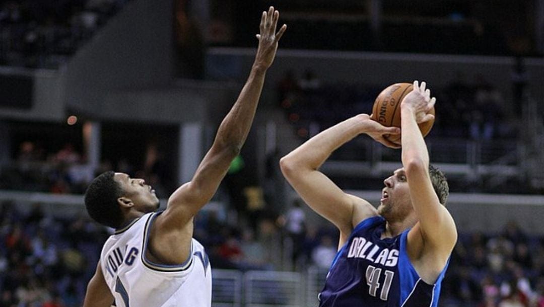 Dirk Nowitzki shoots over Nick Young in an NBA game in 2008.