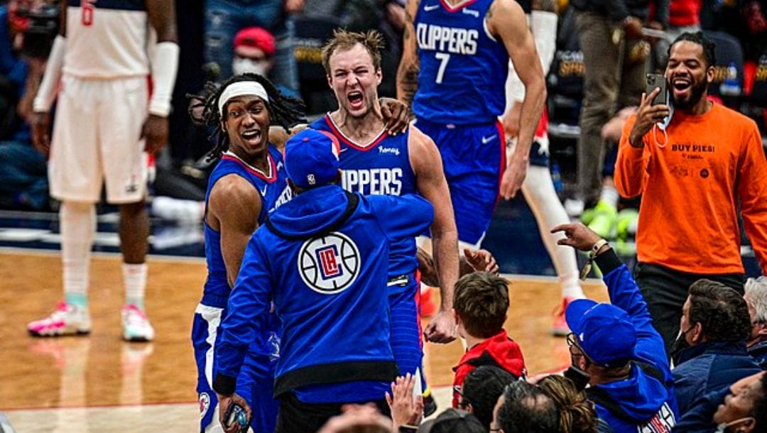 Clippers guard Luke Kennard celebrates game winning bucket to the delight of his teammates.
