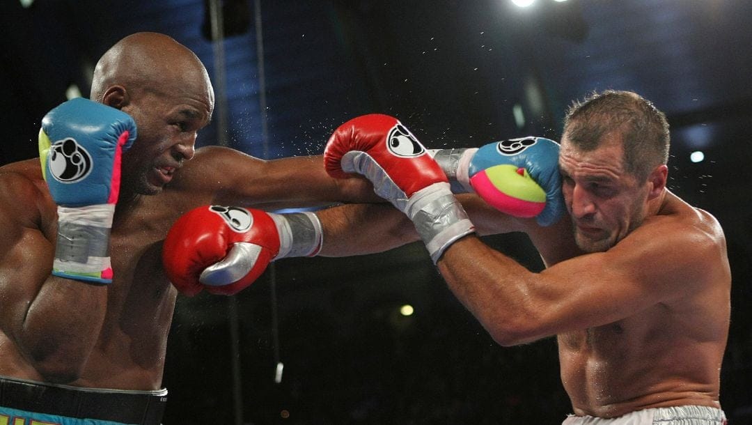Bernard Hopkins of Philadelphia, PA, left, punches Sergey Kovalev of Russia during the 12th round of the Main Event.