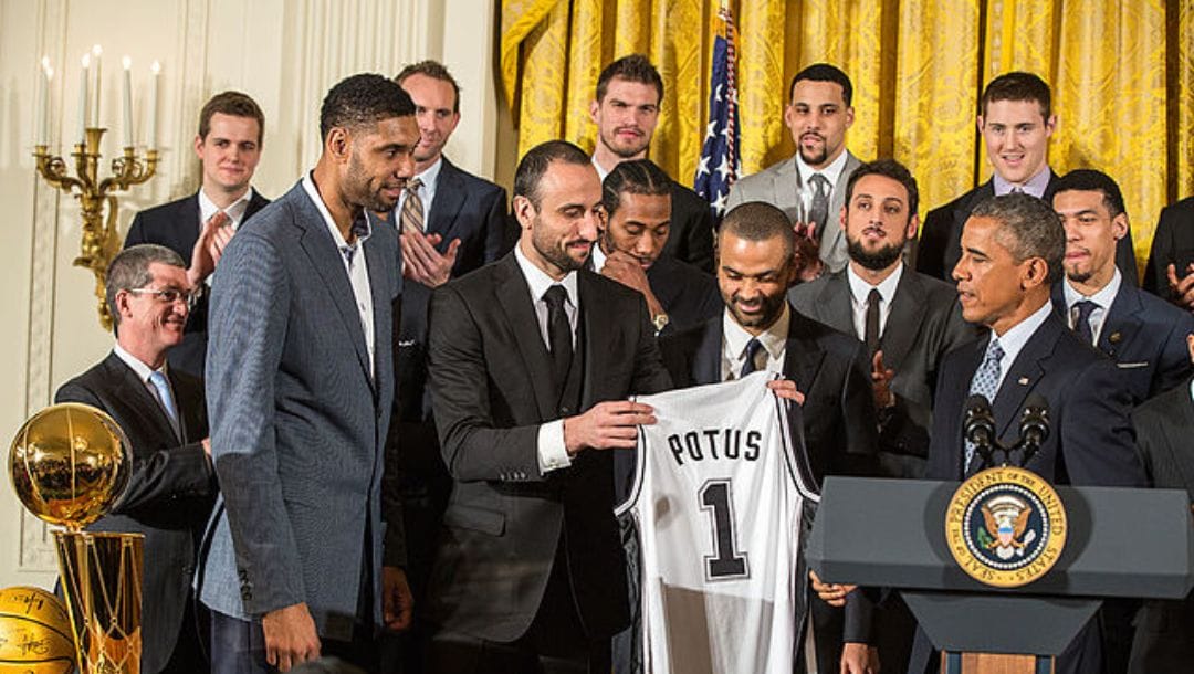 Tim Duncan, Manu Ginobili and Tony Parker present President Barack Obama with a Spurs team jersey during an event to welcome the 2014 NBA Champion San Antonio Spurs.
