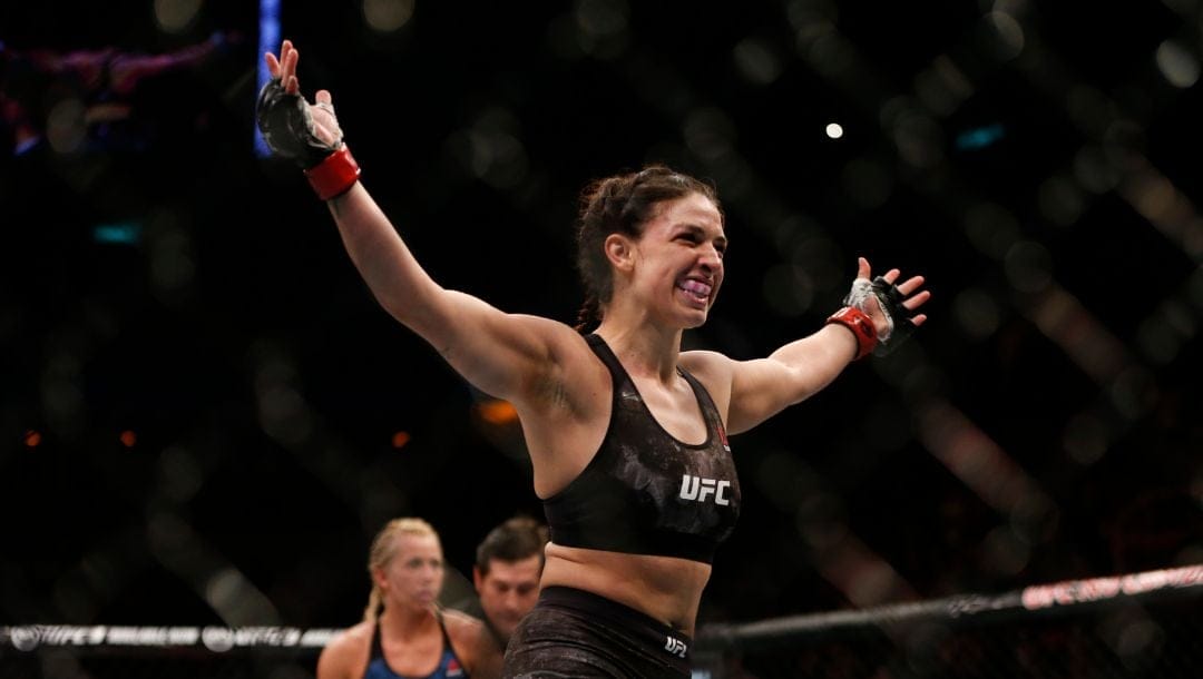Mackenzie Dern, from the United States, celebrates after defeating countrywoman Amanda Cooper.