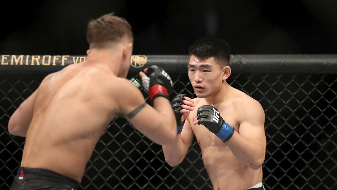 Song Yadong, right, in action against Cody Stamann during their mixed martial arts bout at UFC Fight Night, Saturday.