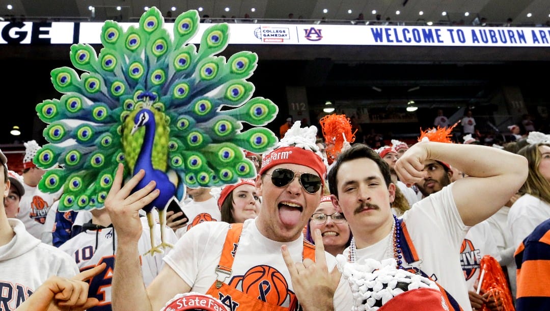 Auburn students get ready for the ESPN Gameday broadcast before the start of an NCAA college basketball game between Auburn and Texas A&M Saturday, Feb. 12, 2022, in Auburn, Ala. (AP Photo/Butch Dill)
