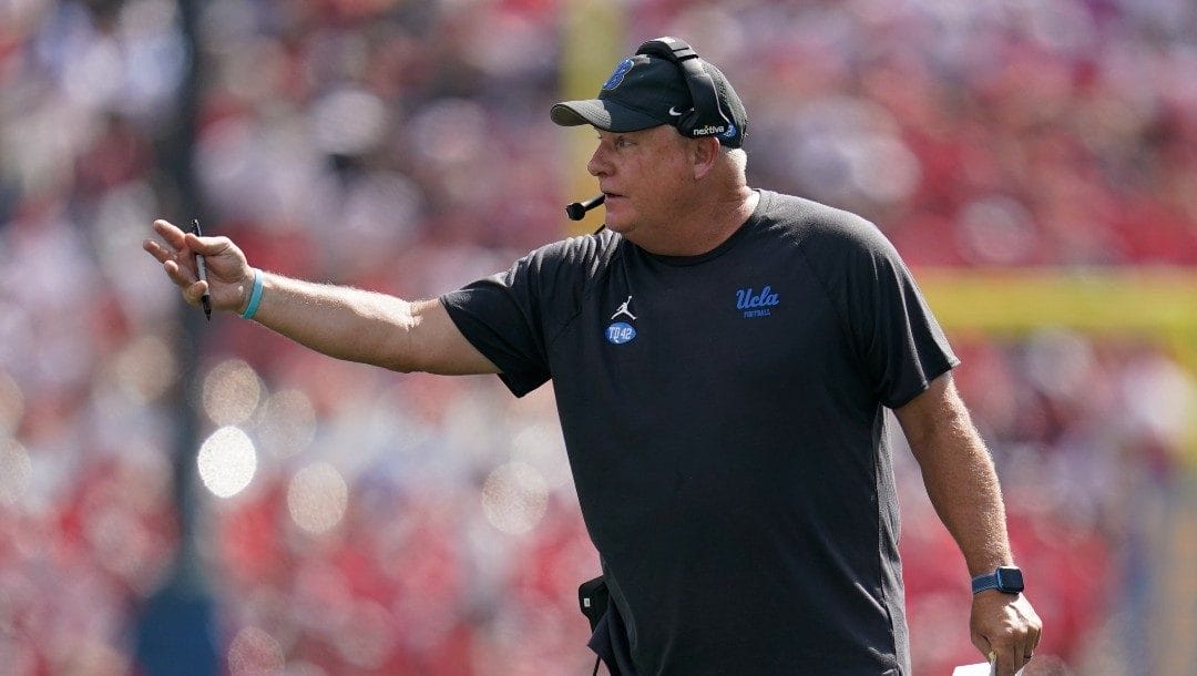 UCLA head coach Chip Kelly signals to a player during an NCAA college football game against Utah in Pasadena, Calif., Saturday, Oct. 8, 2022.