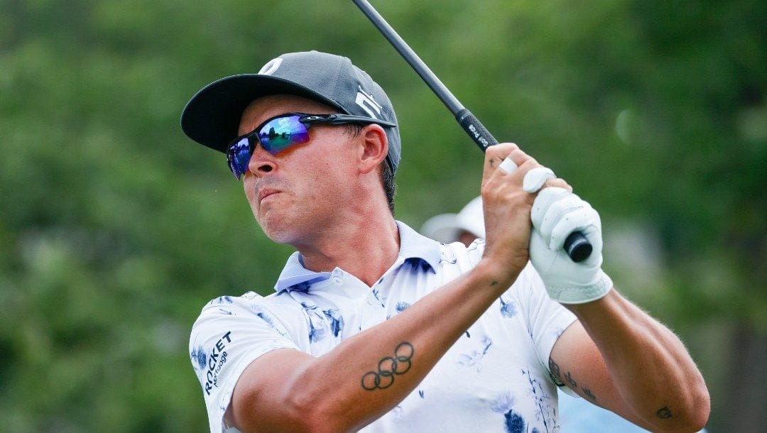 Rickie Fowler hits his tee shot on the 10th hole during the first round of the Wyndham Championship golf tournament, Thursday, Aug. 4, 2022, in Greensboro, N.C.