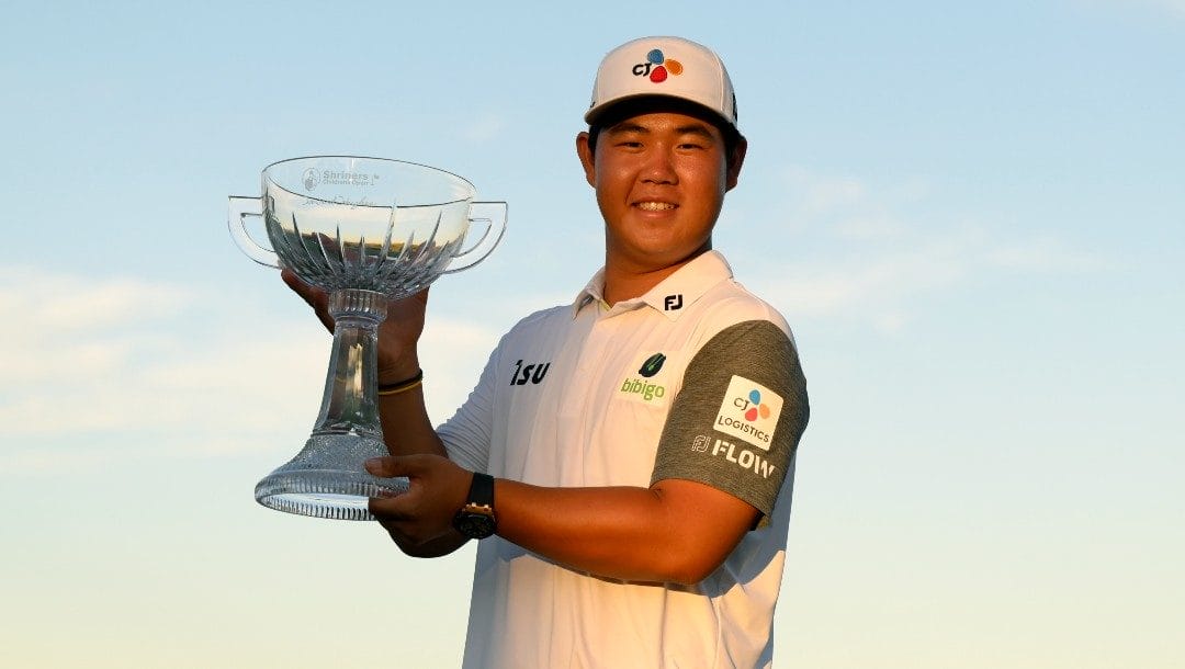Tom Kim, of South Korea, displays the trophy after winning the Shriners Children's Open golf tournament, Sunday, Oct. 9, 2022, in Las Vegas.