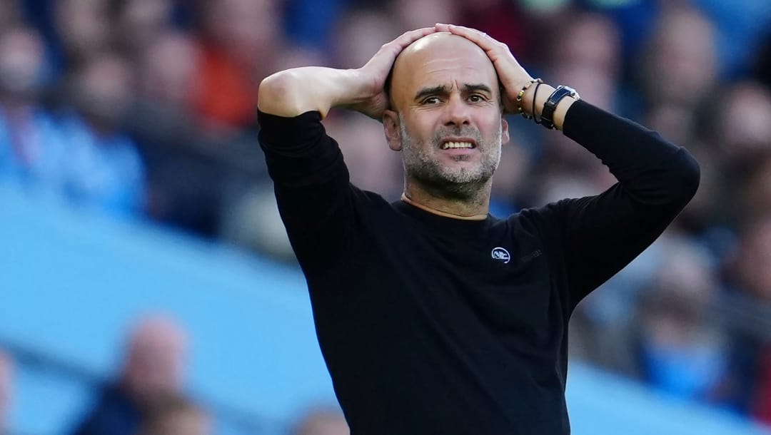 Manchester City's head coach Pep Guardiola reacts during the English Premier League soccer match between Manchester City and Southampton at Etihad stadium in Manchester, England, Saturday, Oct. 8, 2022.