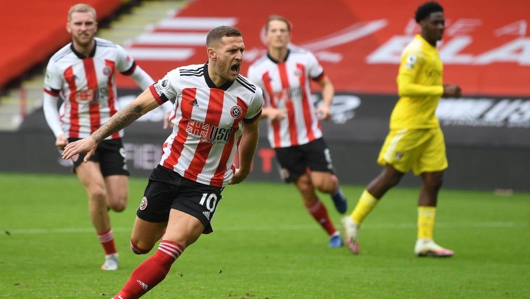 Sheffield United's Billy Sharp celebrates after scoring his side's opening goal from the penalty spot during the English Premier League soccer match between Sheffield United and Fulham at Bramall Lane stadium in Sheffield, England, Sunday, Oct. 18, 2020.