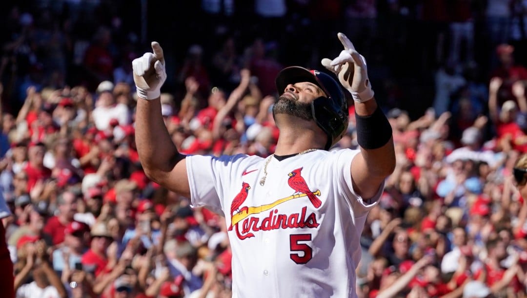 St. Louis Cardinals' Albert Pujols celebrates after hitting a solo home run during the third inning of a baseball game against the Pittsburgh Pirates Sunday, Oct. 2, 2022, in St. Louis.