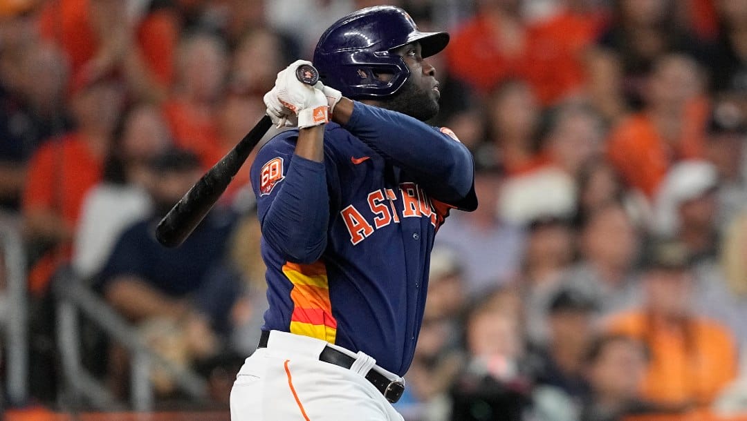 Houston Astros designated hitter Yordan Alvarez watches his two-run home run against the Seattle Mariners during the sixth inning in Game 2 of an American League Division Series baseball game in Houston, Thursday, Oct. 13, 2022.