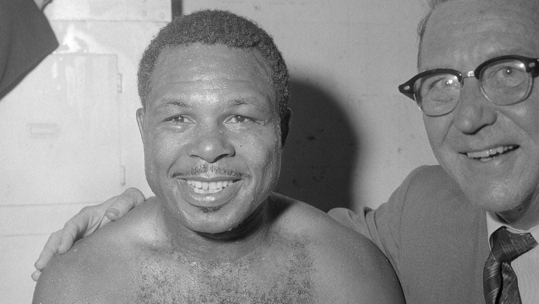 Boxer Archie Moore is shown in dressing room after beating Tony Anthony for the World Heavyweight title in Los Angeles, California.