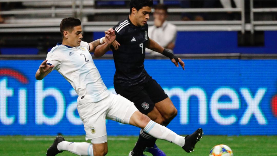 Argentina's Lucas Martinez Quarta (2) and Mexico's Raul Jimenez (9) compete for control of the ball during the first half of an international friendly soccer match Tuesday, Sept. 10, 2019, in San Antonio.