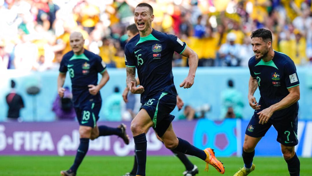 Australia's Mitchell Duke, center, celebrates after he scored the opening goal during the World Cup group D soccer match between Tunisia and Australia at the Al Janoub Stadium in Al Wakrah, Qatar, Saturday, Nov. 26, 2022.