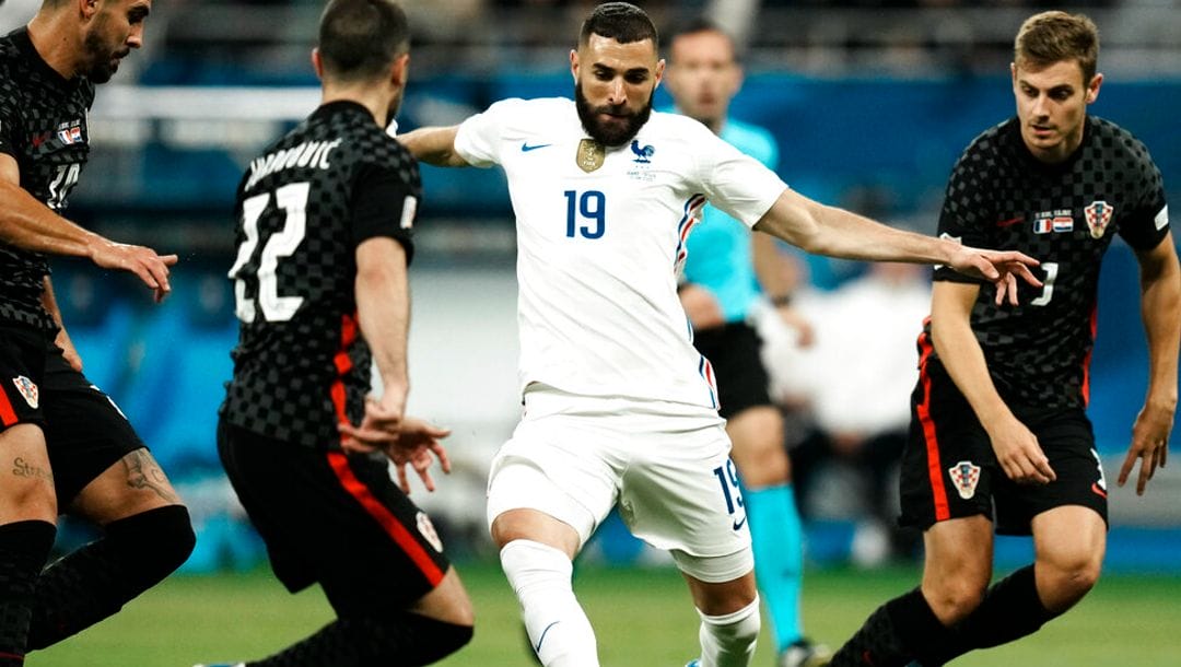 France's Karim Benzema, second right, duels for the ball with Croatia's Josip Juranovic, second left, during the UEFA Nations League soccer match between France and Croatia at the Stade de France in Saint Denis near Paris, Monday, June 13, 2022.