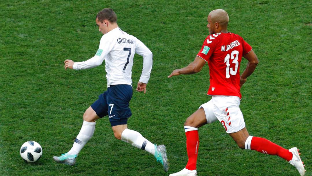​​France's Antoine Griezmann, left, and Denmark's Mathias Jorgensen challenge for the ball during the group C match between Denmark and France at the 2018 soccer World Cup at the Luzhniki Stadium in Moscow, Russia, Tuesday, June 26, 2018.