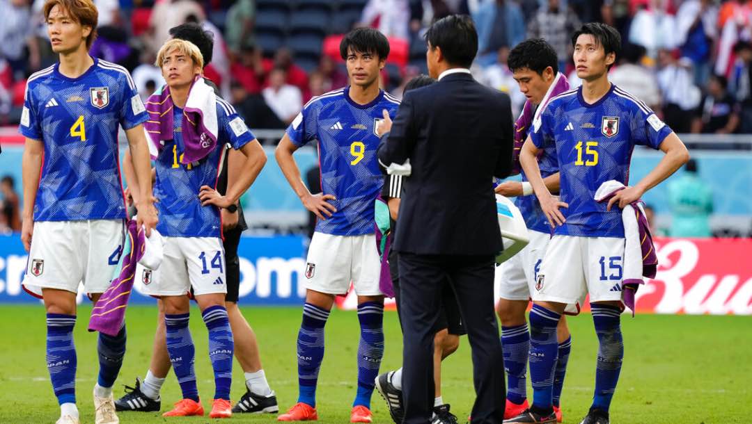 Japan's players stand together after losing the World Cup, group E soccer match between Japan and Costa Rica, at the Ahmad Bin Ali Stadium in Al Rayyan , Qatar, Sunday, Nov. 27, 2022.