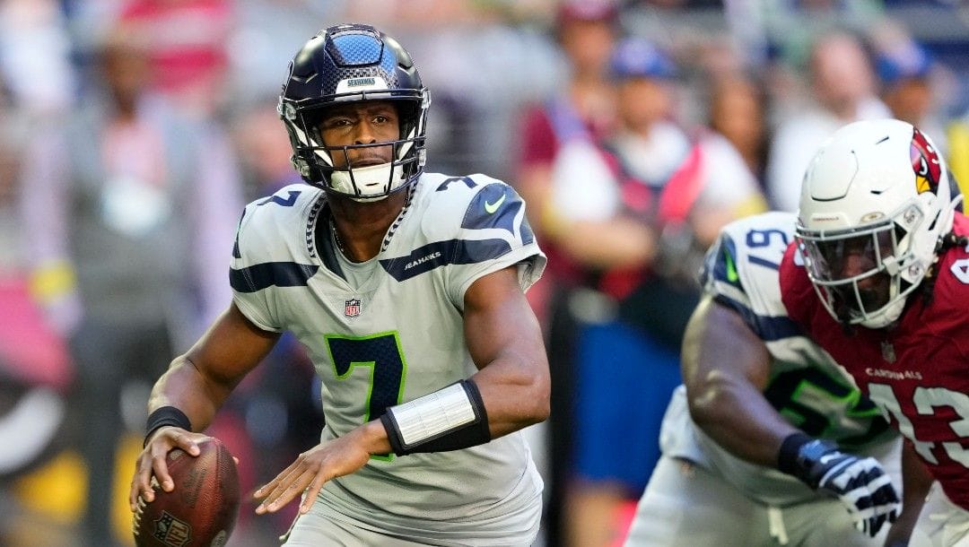 Seattle Seahawks quarterback Geno Smith (7) passes against the Arizona Cardinals during the first half of an NFL football game in Glendale, Ariz., Sunday, Nov. 6, 2022.