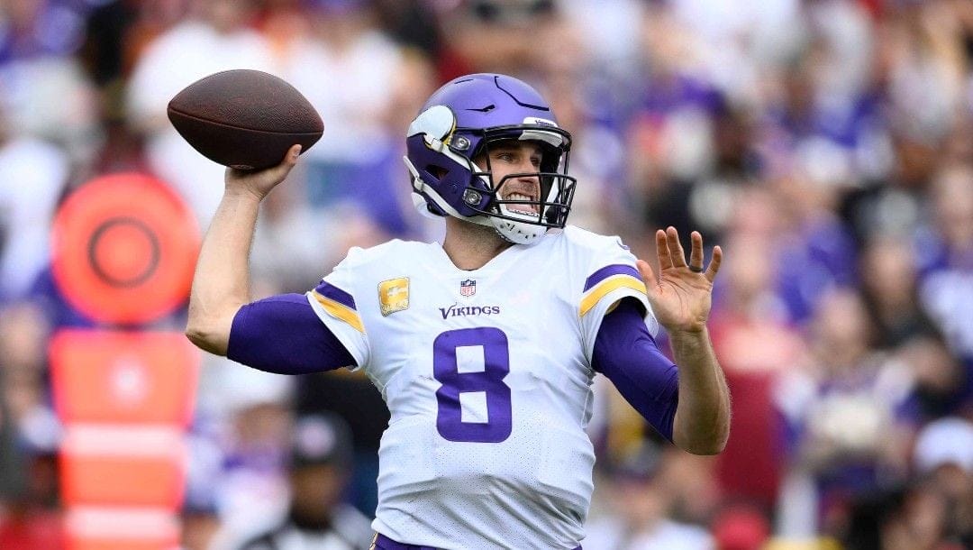 Minnesota Vikings quarterback Kirk Cousins (8) in action during the first half of an NFL football game against the Washington Commanders, Sunday, Nov. 6, 2022, in Landover, Md.