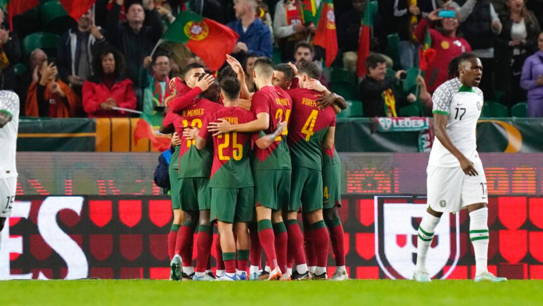 Portugal players celebrate after Bruno Fernandes scored the opening goal during an international friendly soccer match between Portugal and Nigeria at the Jose Alvalade stadium in Lisbon, Thursday, Nov. 17, 2022.