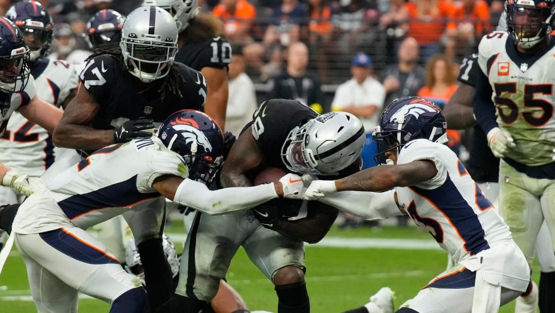 Las Vegas Raiders running back Josh Jacobs (28) during the first half of an NFL football game against the Denver Broncos, Sunday, Oct 2, 2022, in Las Vegas. (AP Photo/Rick Scuteri)