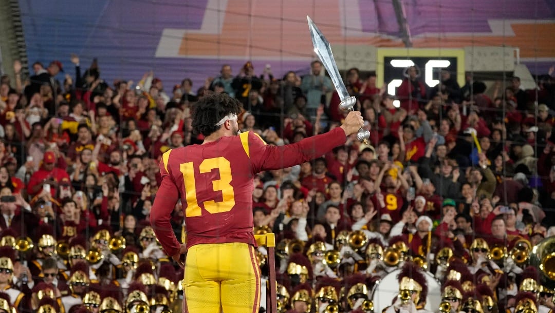 Southern California quarterback Caleb Williams leads the USC Marching Band after USC defeat UCLA 48-45 in an NCAA college football game Saturday, Nov. 19, 2022, in Pasadena, Calif. (AP Photo/Mark J. Terrill)